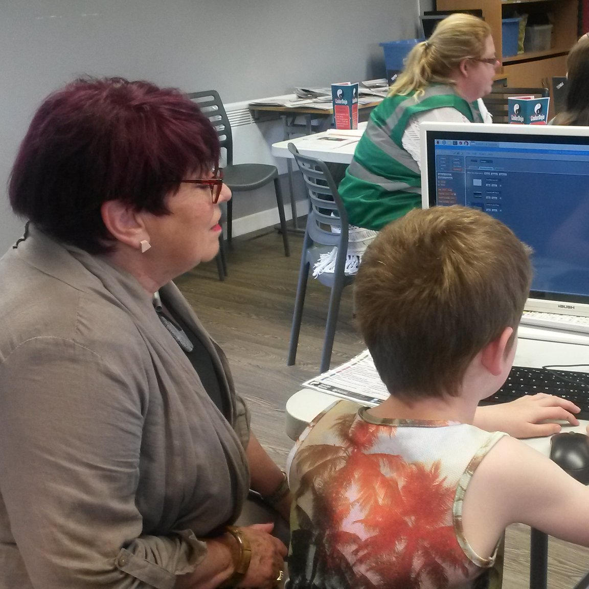 Photograph of a Ninja showing off his Scratch project at Tameside CoderDojo