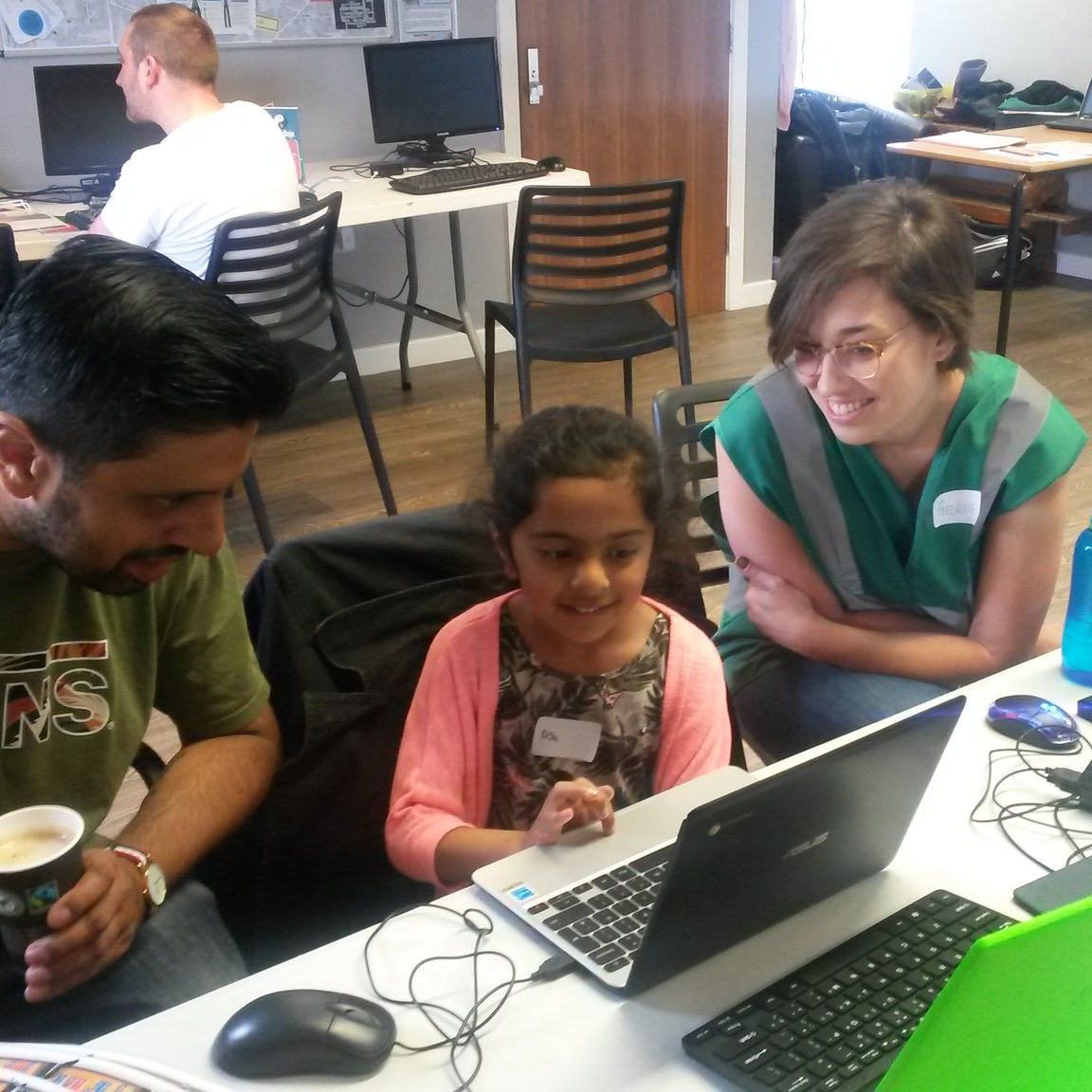 Photograph of a Ninja learning scratch at Tameside CoderDojo, with our mentor Georgie